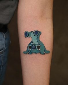 Tiny Stitch in Costume Tattoo, a tattoo design rendered in clean detailed linework.