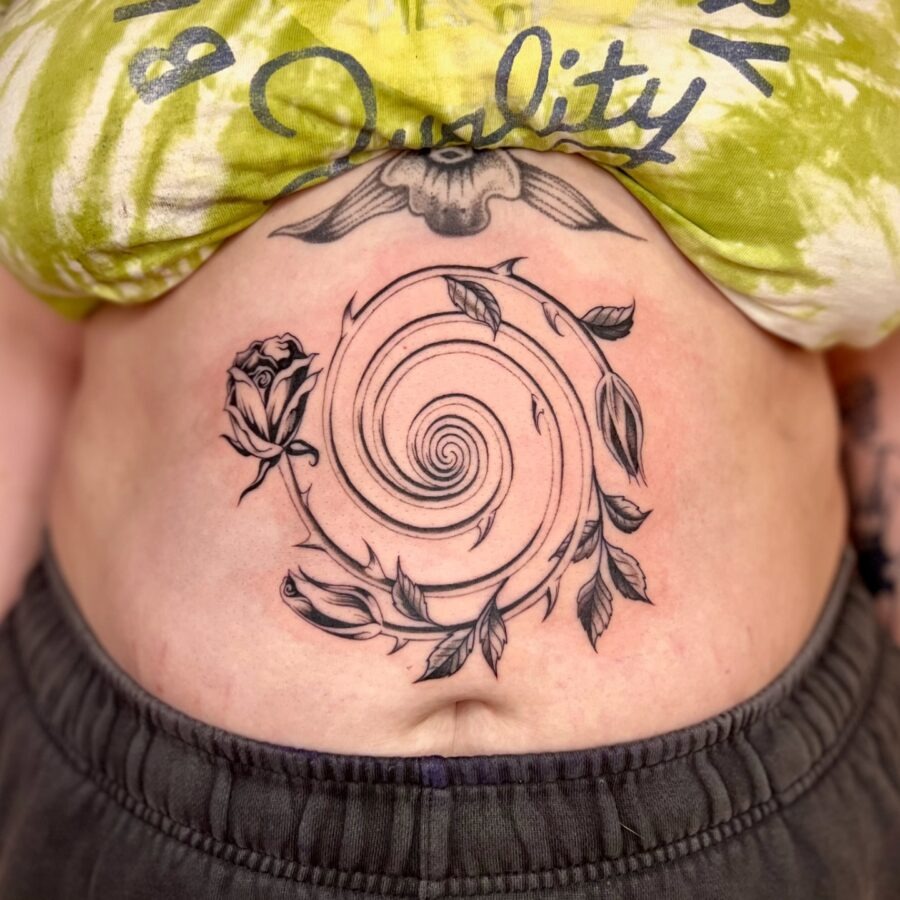 Artistic spiral tattoo with floral elements Tattoo Design