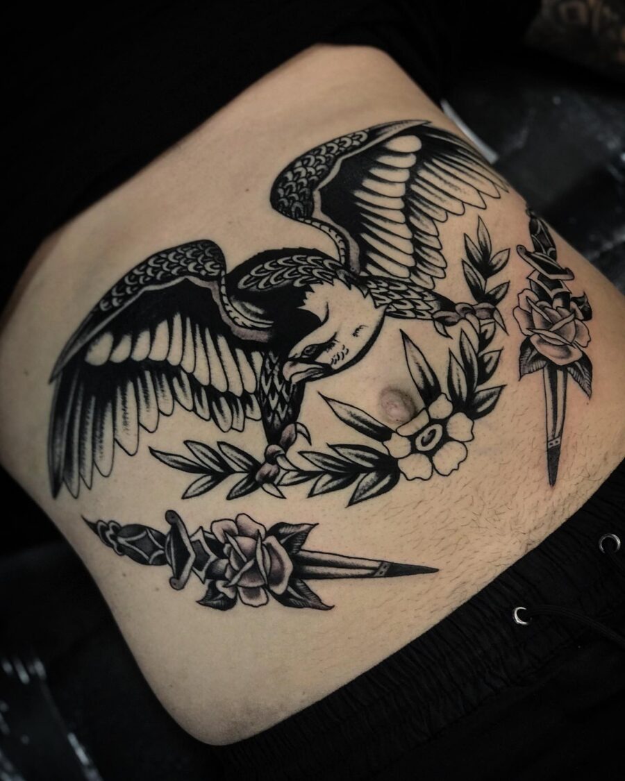 Bold stomach tattoo featuring bird and flowers Tattoo Design