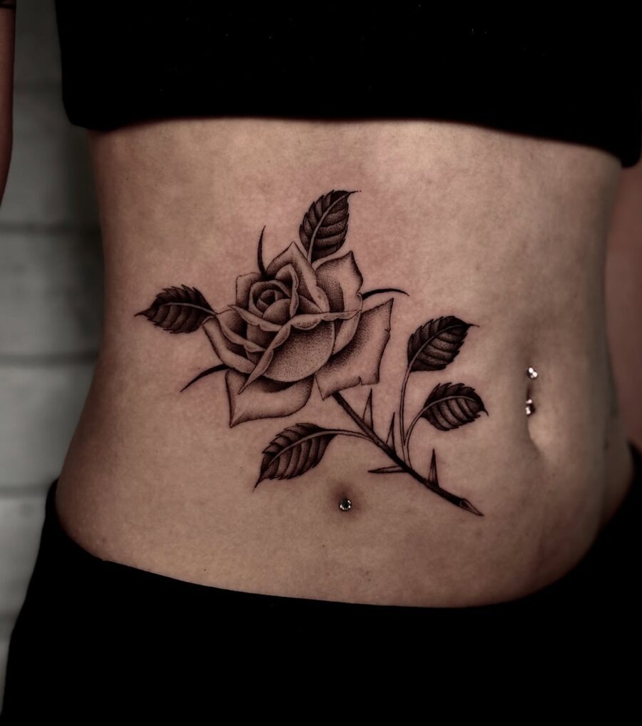 Elegant black rose tattoo on the stomach Tattoo Design