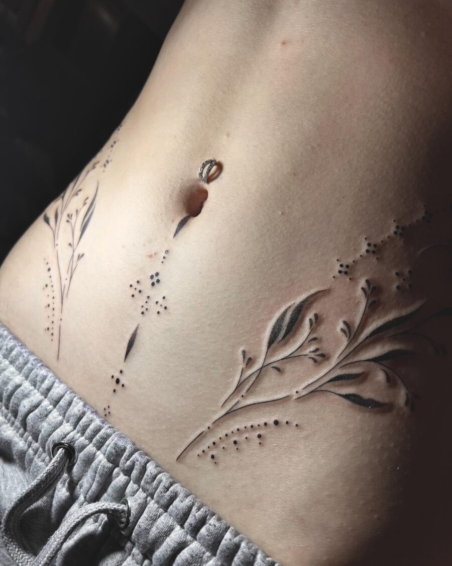 Elegant floral stomach tattoo design in black Tattoo Design