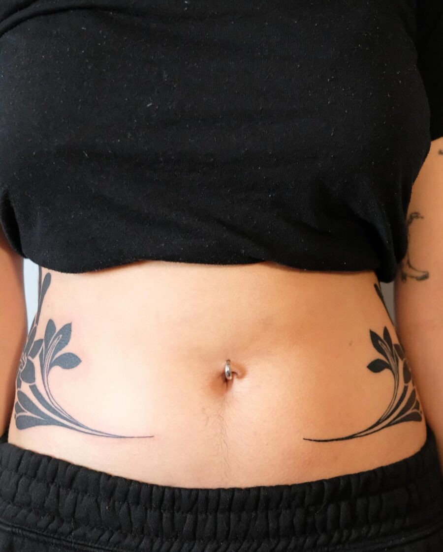 Elegant floral stomach tattoo design Tattoo Design