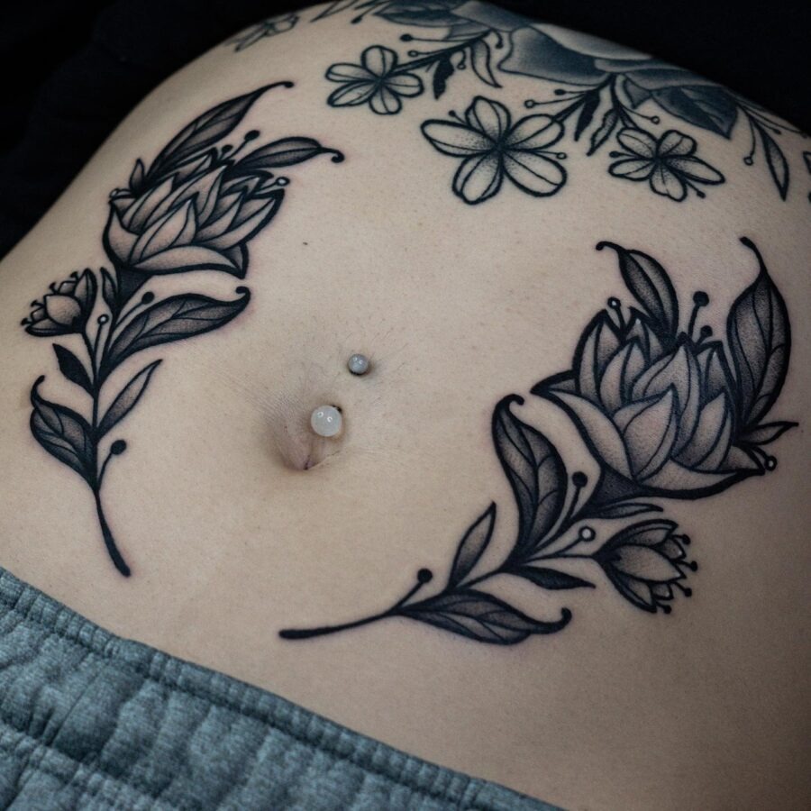 Elegant floral stomach tattoo design with intricate details Tattoo Design