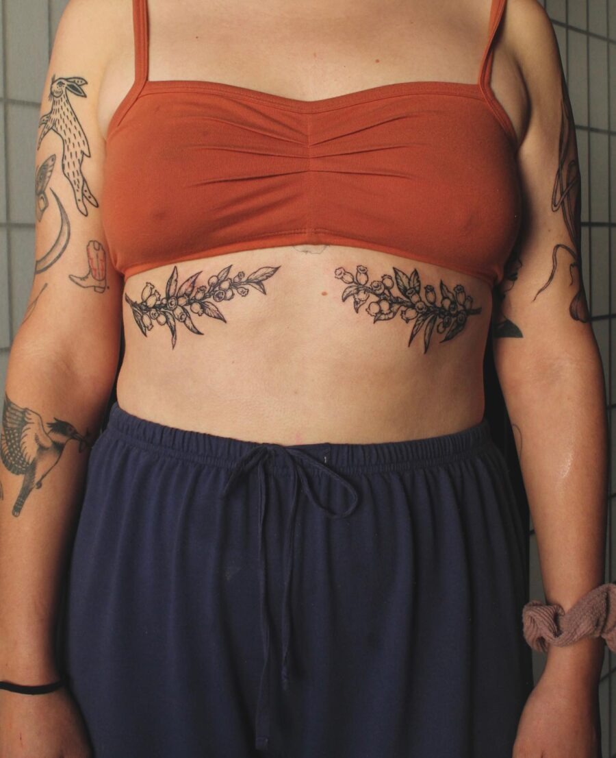 Elegant floral stomach tattoo highlighting body art Tattoo Design