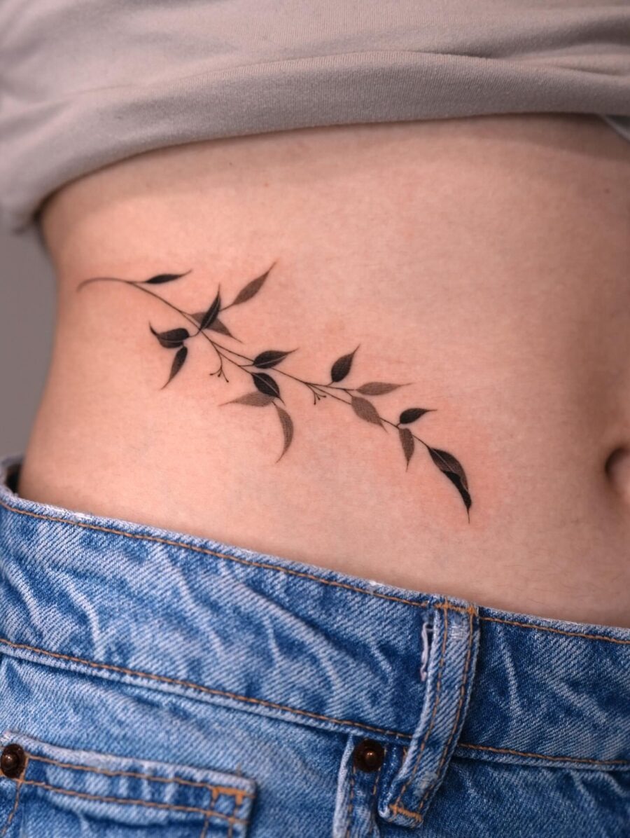 Elegant foliage stomach tattoo design Tattoo Design