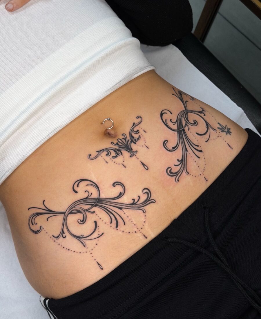 Elegant intricate designs on the stomach Tattoo Design