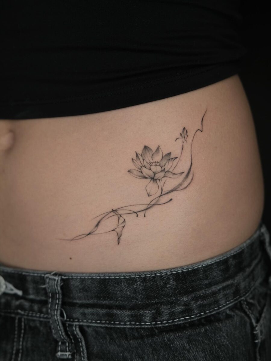 Elegant lotus flower stomach tattoo design Tattoo Design