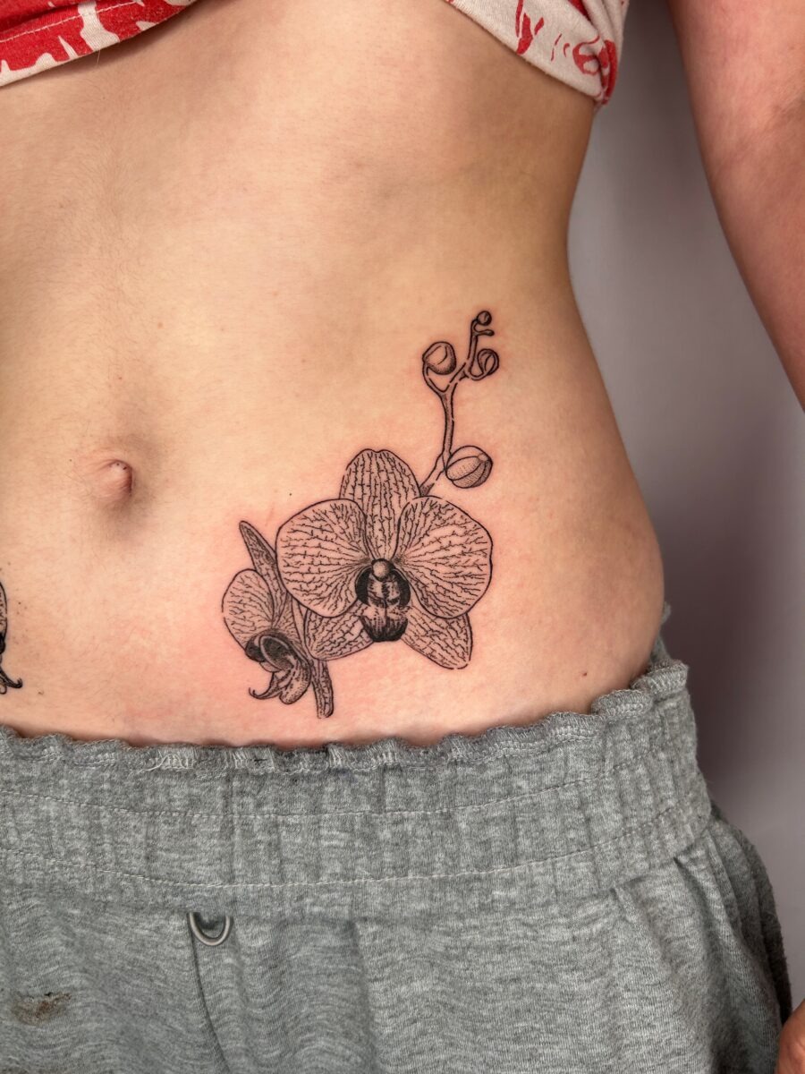 Elegant orchid tattoo on the stomach Tattoo Design