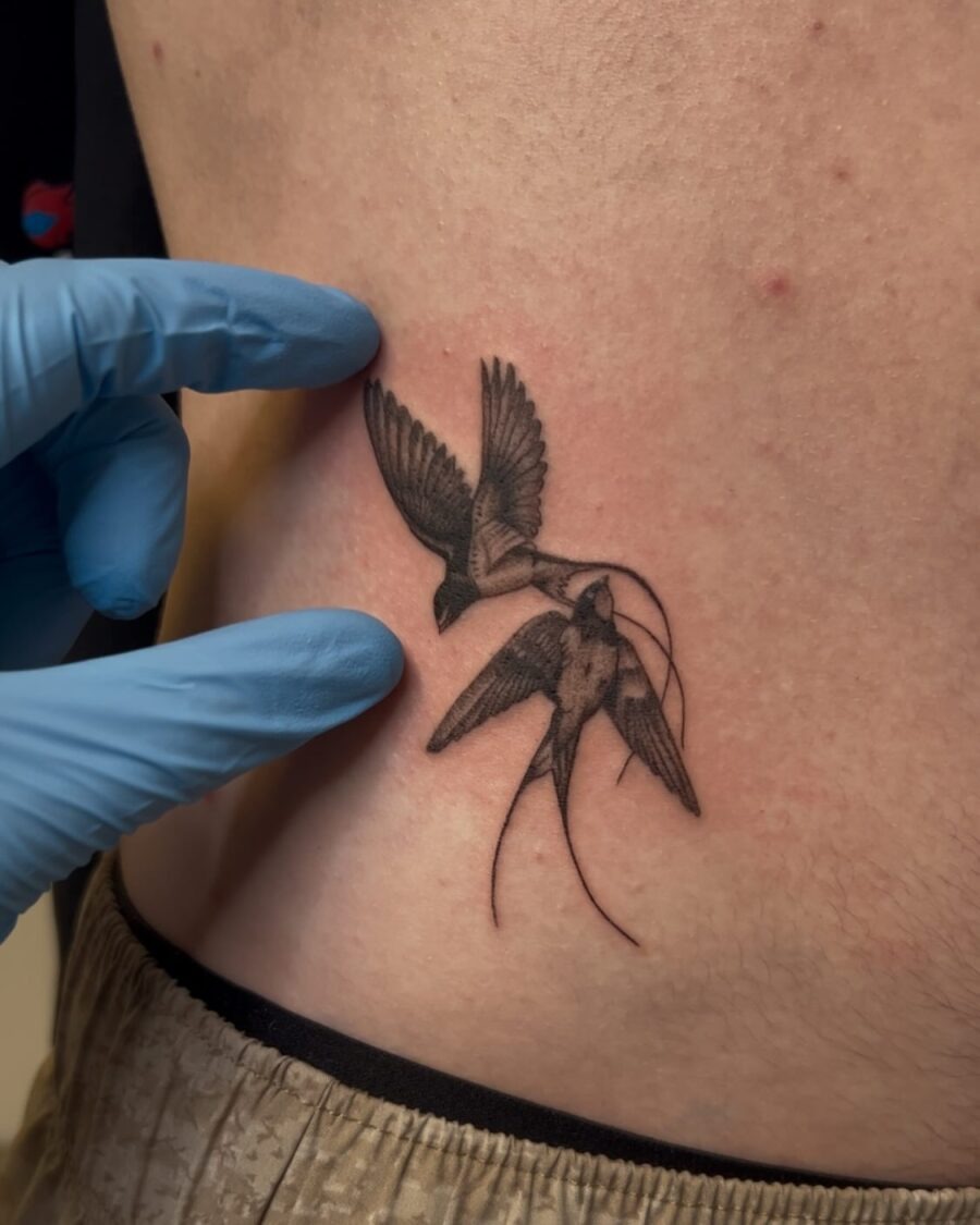 Eloquent swallow tattoo design on the stomach Tattoo Design