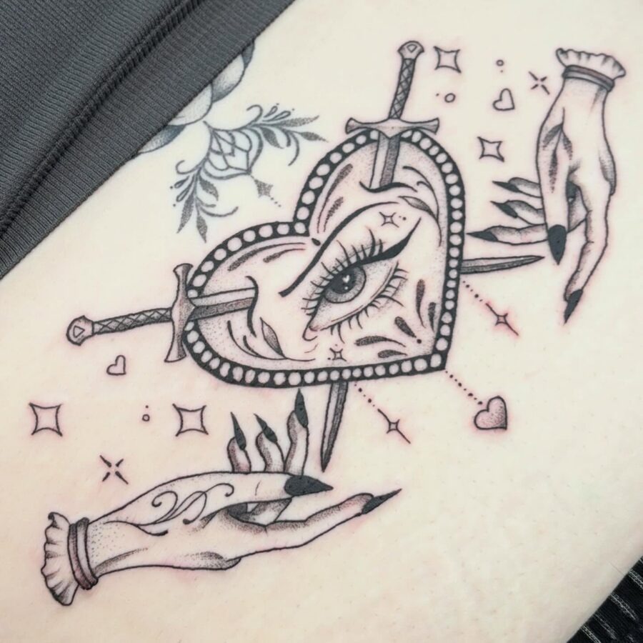 Intricate heart design with swords and hands Tattoo Design