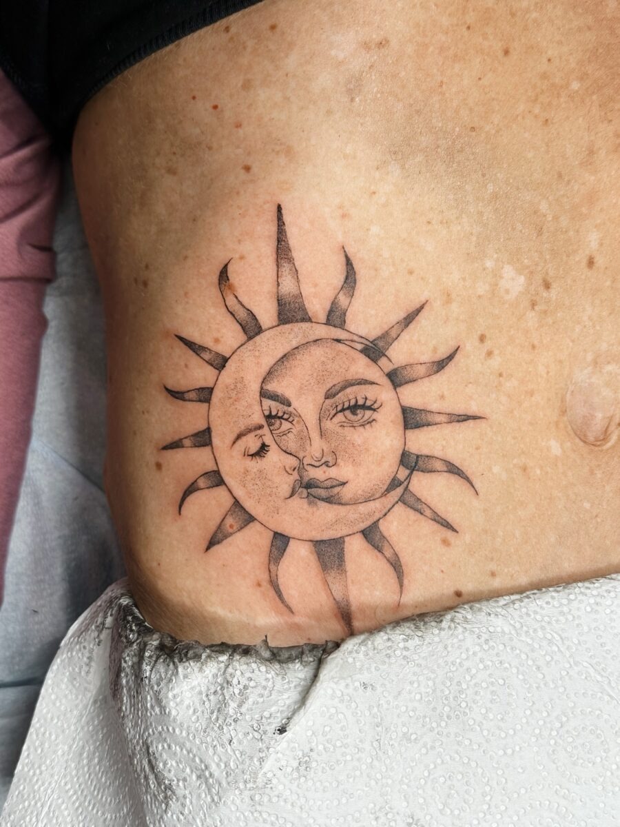 Intricate sun and moon face tattoo design Tattoo Design