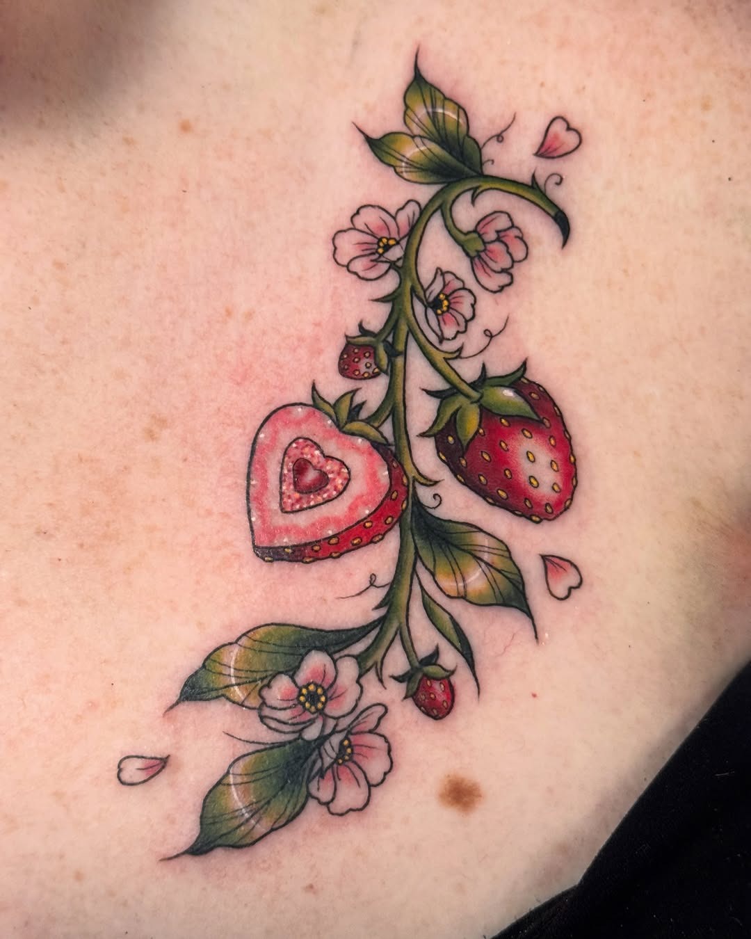 Charming strawberry tattoo with floral accents Tattoo Design