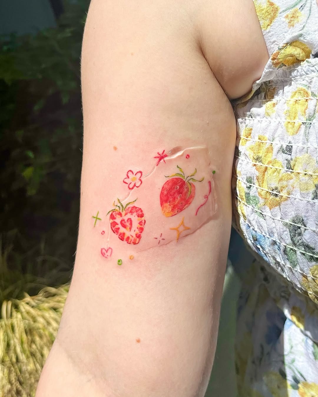Colorful strawberry tattoos radiating summer vibes Tattoo Design