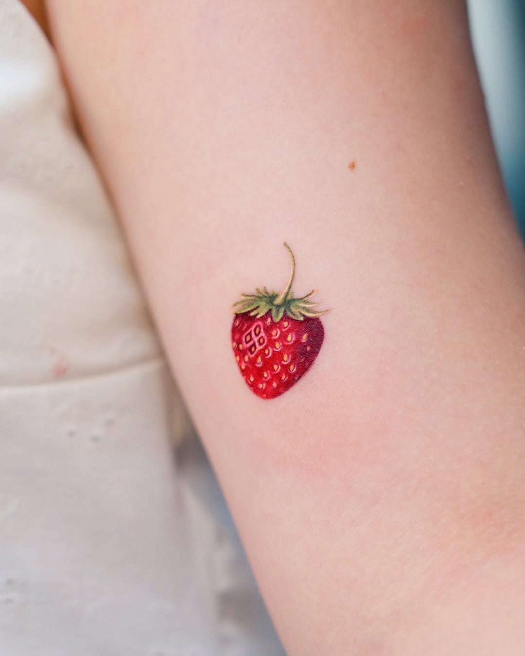 Delicate Strawberry Tattoo on Arm Tattoo Design