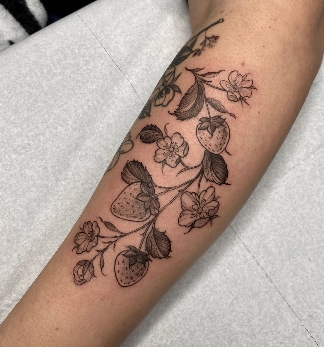 Elegant strawberry and flower tattoo design Tattoo Design
