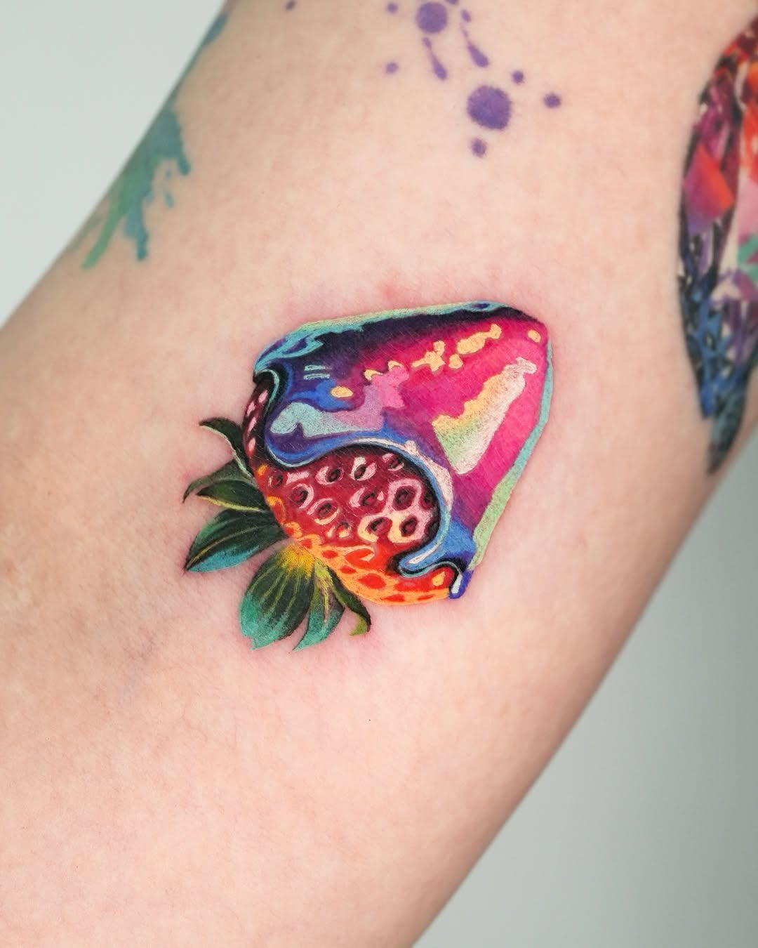 Vibrant strawberry tattoo dripping with color Tattoo Design