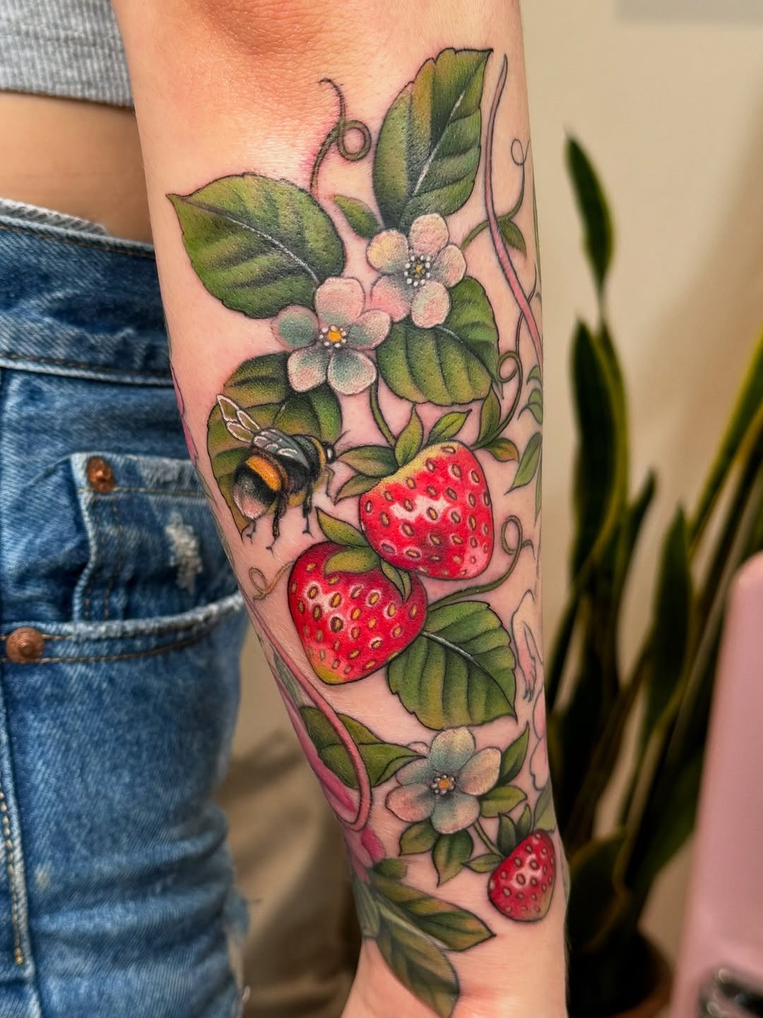Vibrant strawberry tattoo with floral details Tattoo Design