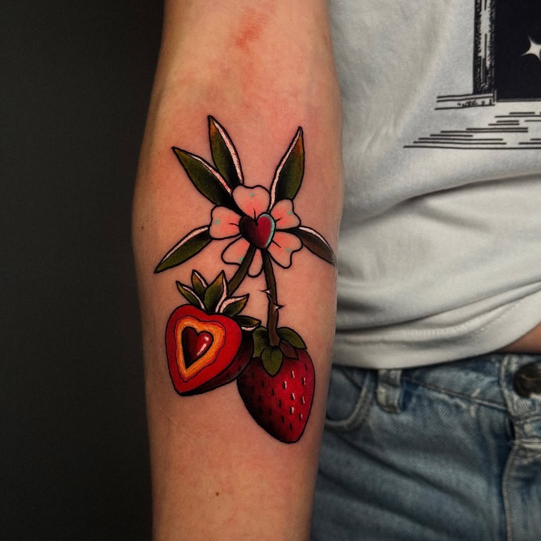 Vibrant strawberry tattoo with floral elements Tattoo Design