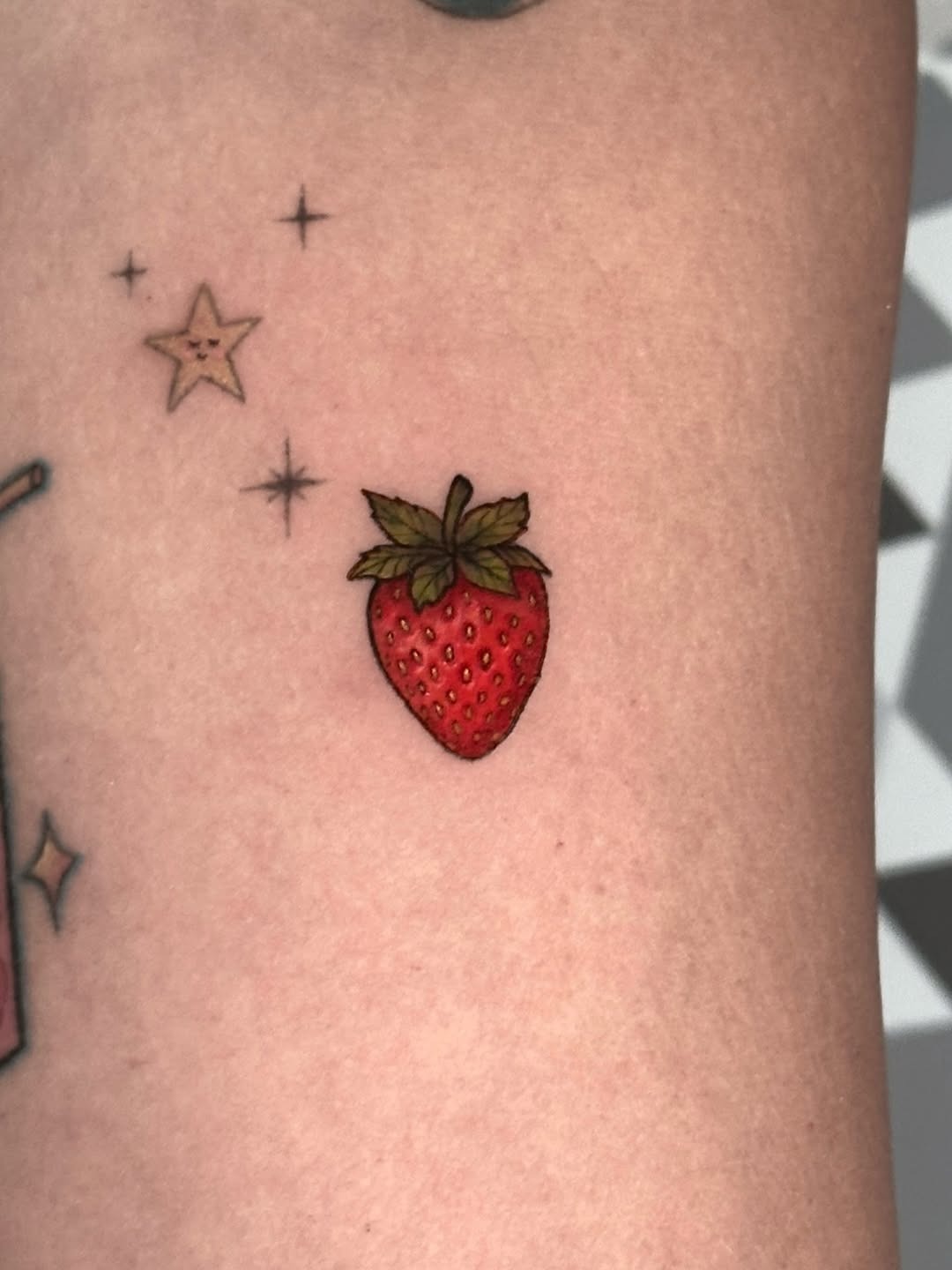 Whimsical Strawberry Tattoo Amidst Stars Tattoo Design