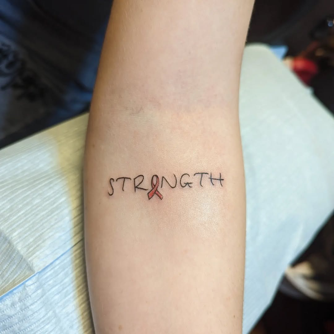 Meaningful strength tattoo featuring symbolic tattoo promoting strength and resilience in bold black ink