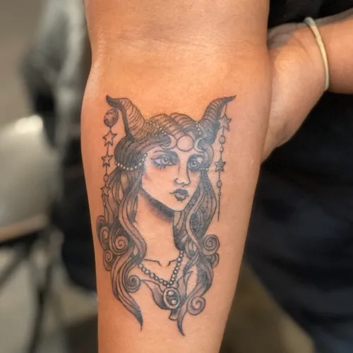 Majestic Female Figure with Horns Tattoo Design