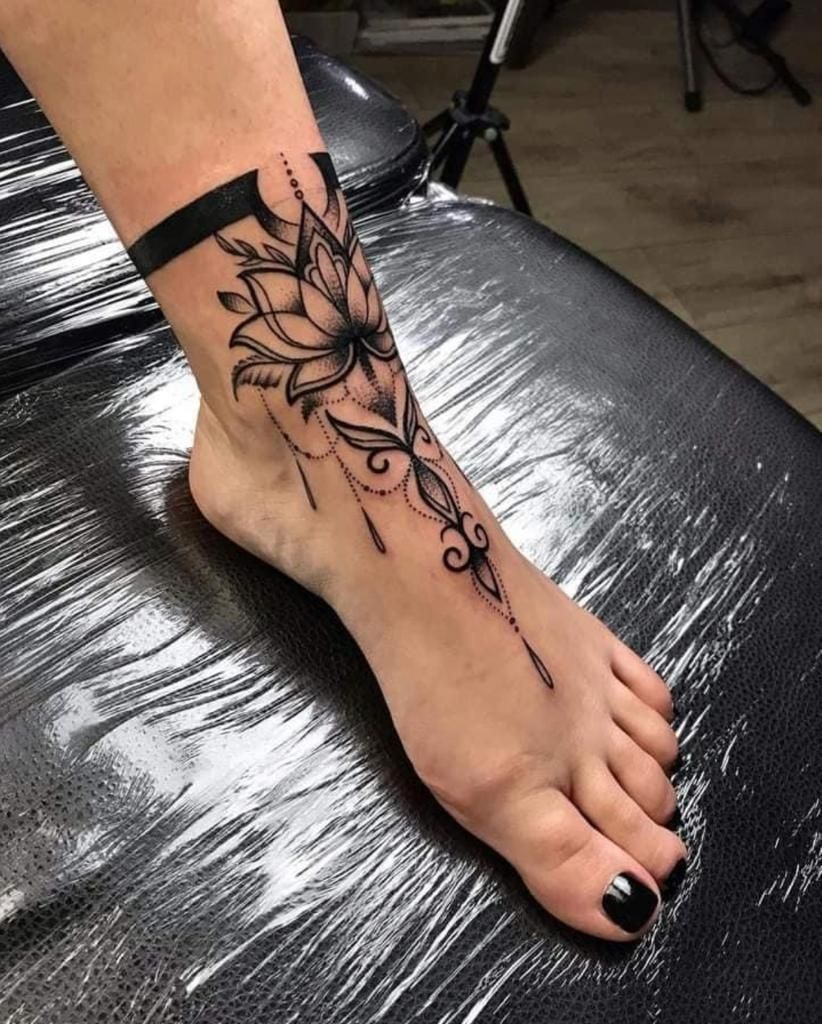 Butterfly and Floral Foot Tattoo with Soft Color Tattoo Design