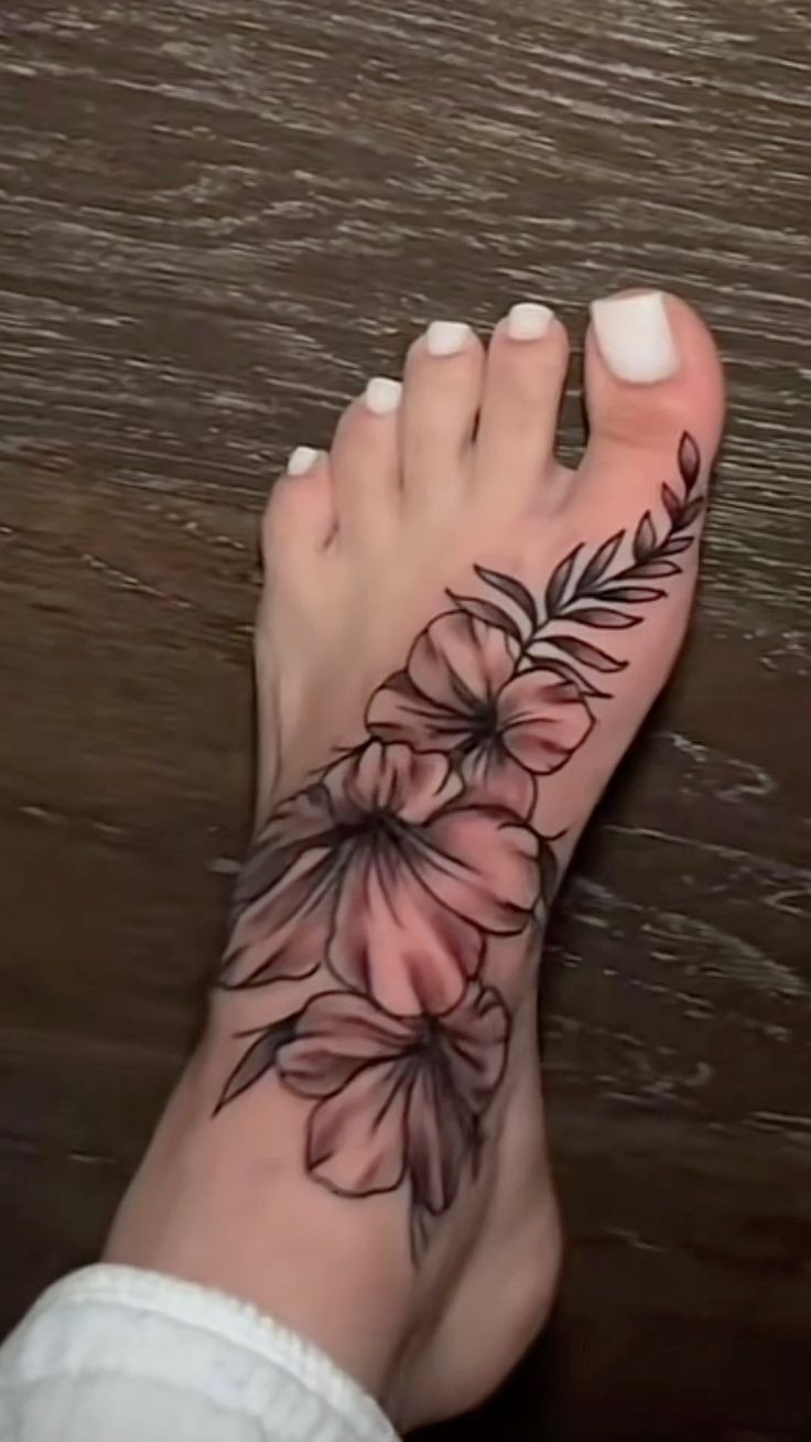 Soft Floral Foot Tattoo With a Natural Flow Tattoo Design