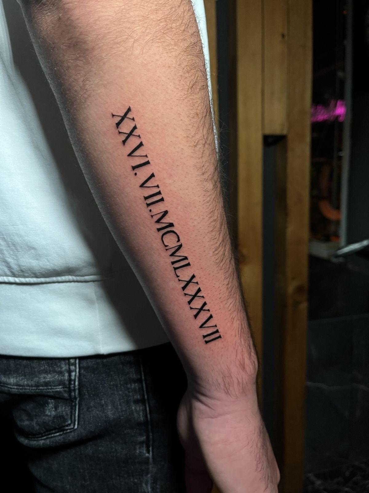 Long Vertical Roman Numeral Forearm Date Tattoo Design