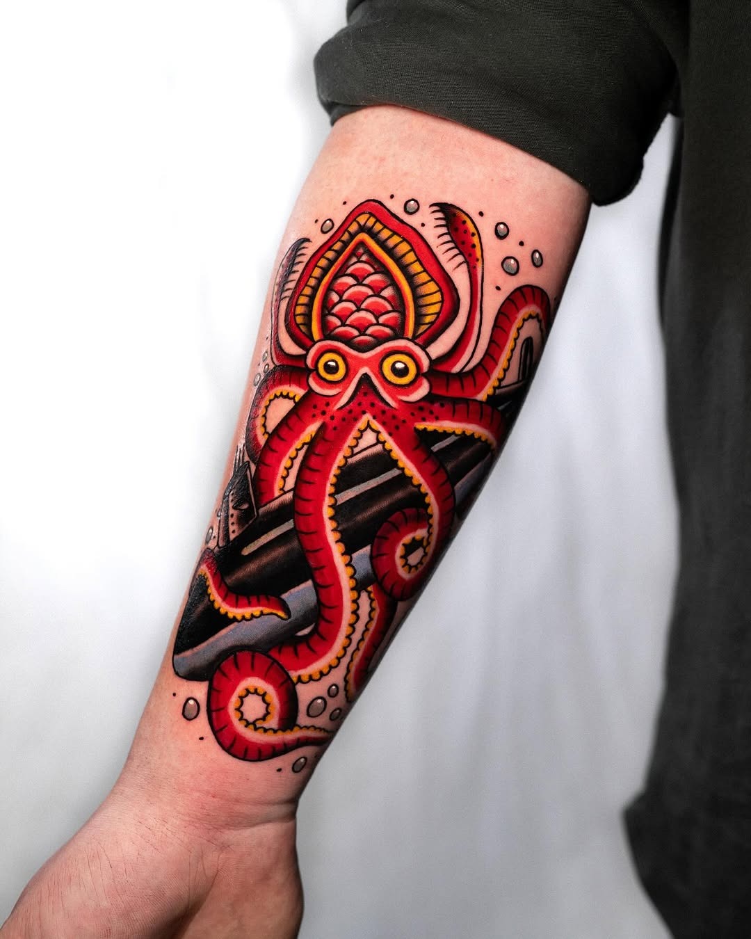 Vibrant octopus embracing a submarine tattoo Tattoo Design