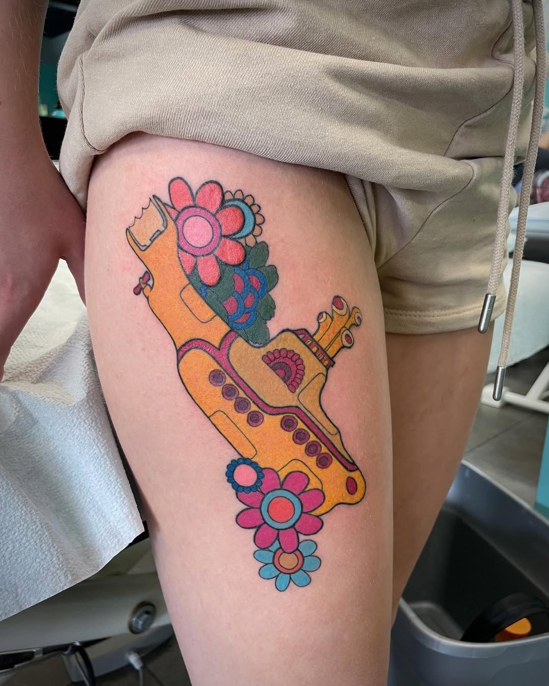 Whimsical submarine tattoo adorned with flowers Tattoo Design