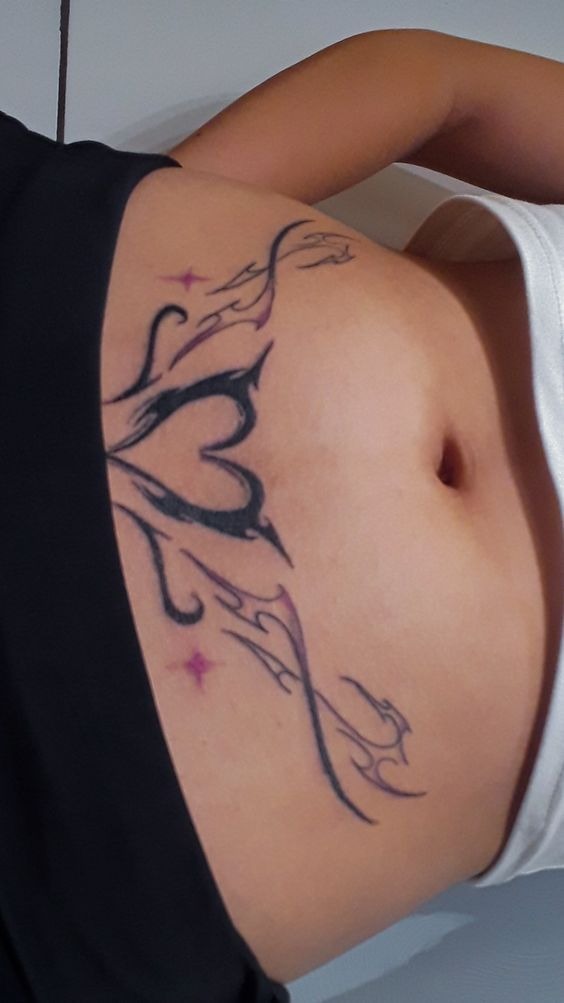 Tribal Heart Succubus Design on the Stomach Tattoo Design