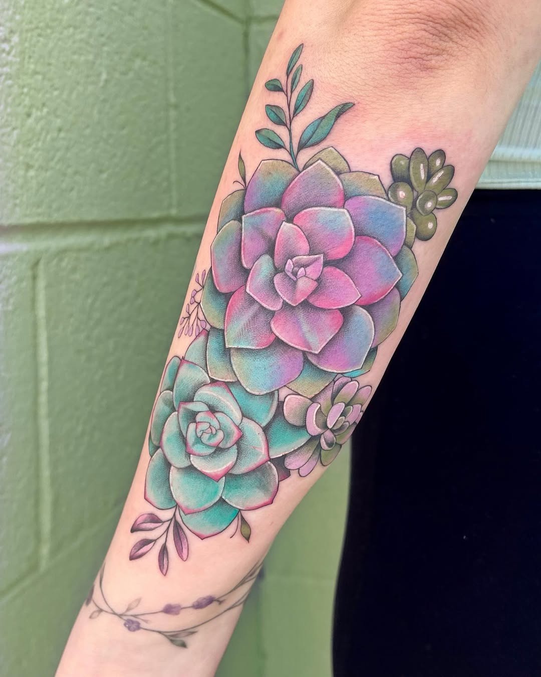 Vibrant succulent tattoo with delicate foliage accents Tattoo Design