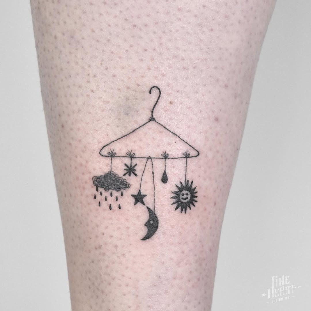 Charming mobile of sun and moon elements Tattoo Design