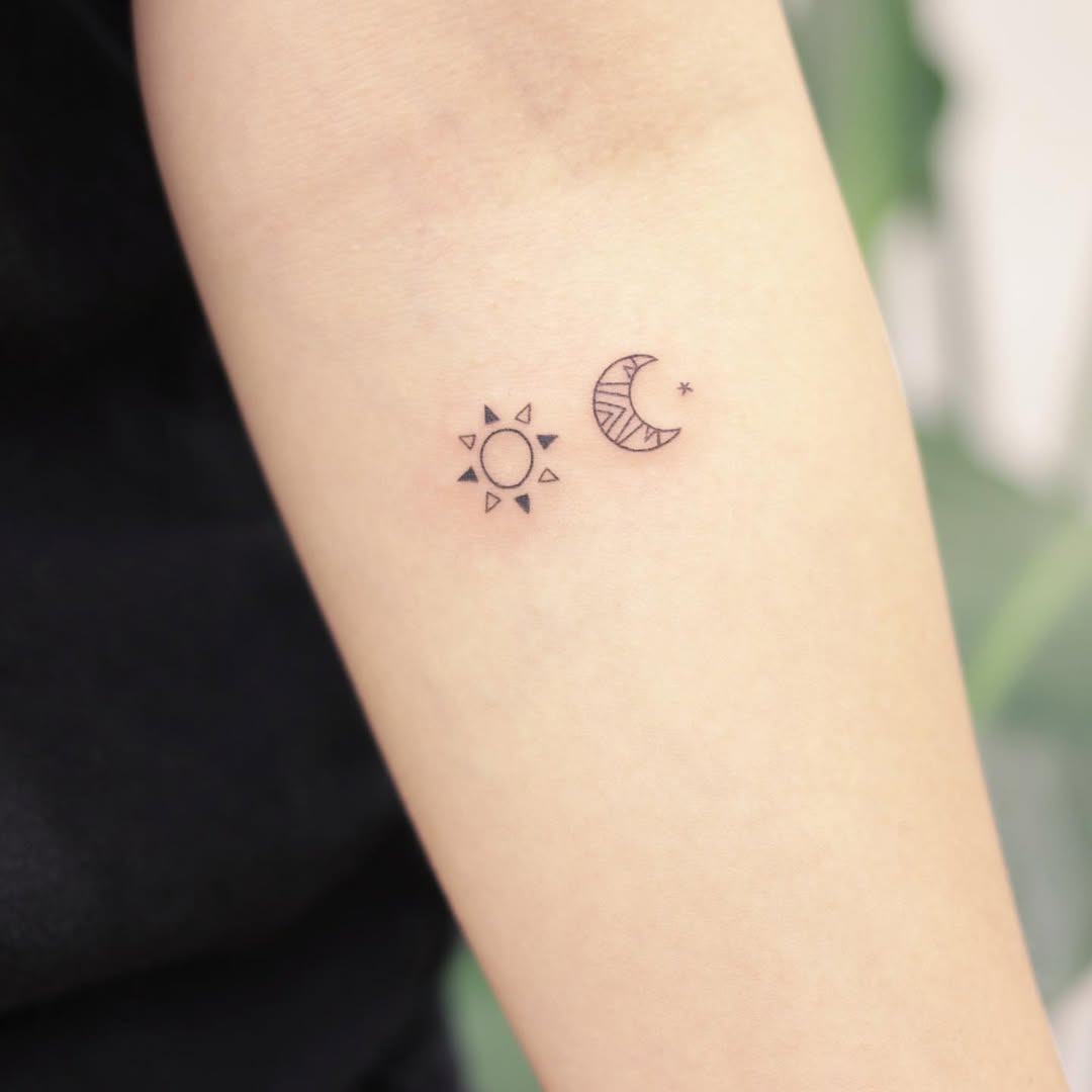 Charming sun and moon tattoo pair on arm Tattoo Design