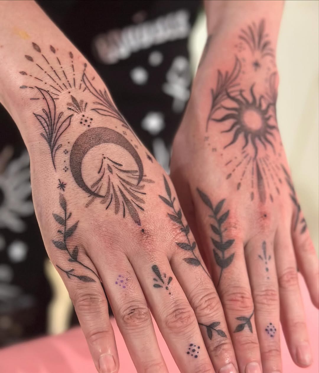 Elegant sun and moon hand tattoos with floral details Tattoo Design
