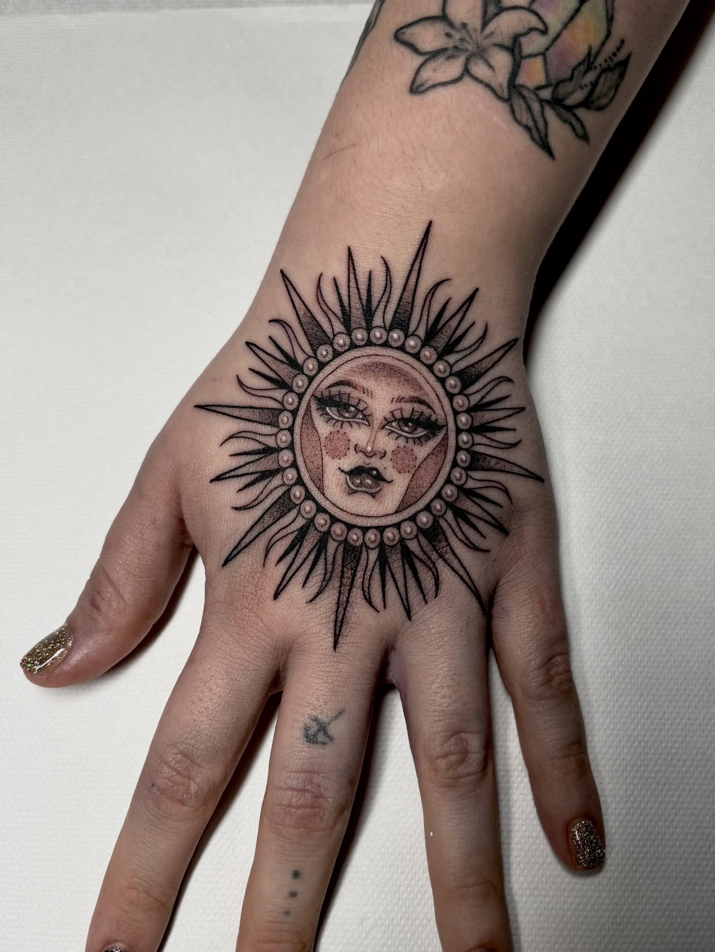 Beaded Sun Face Hand Tattoo Tattoo Design
