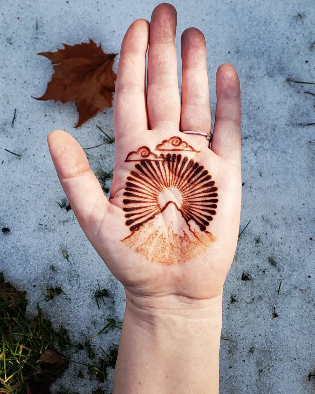 Beautiful sunrise mountain tattoo on palm Tattoo Design