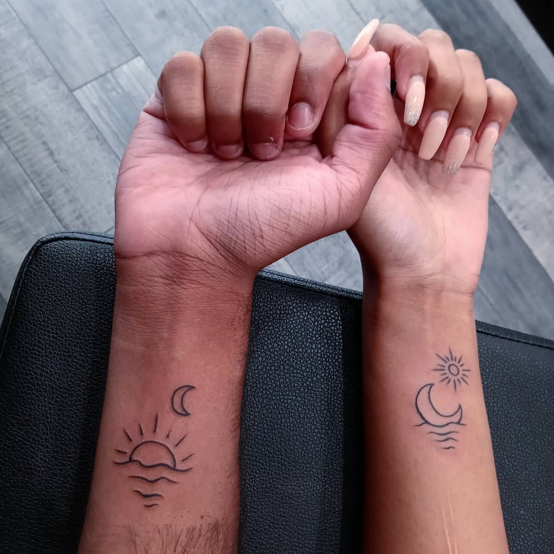 Charming sunrise and moon tattoos on wrists Tattoo Design