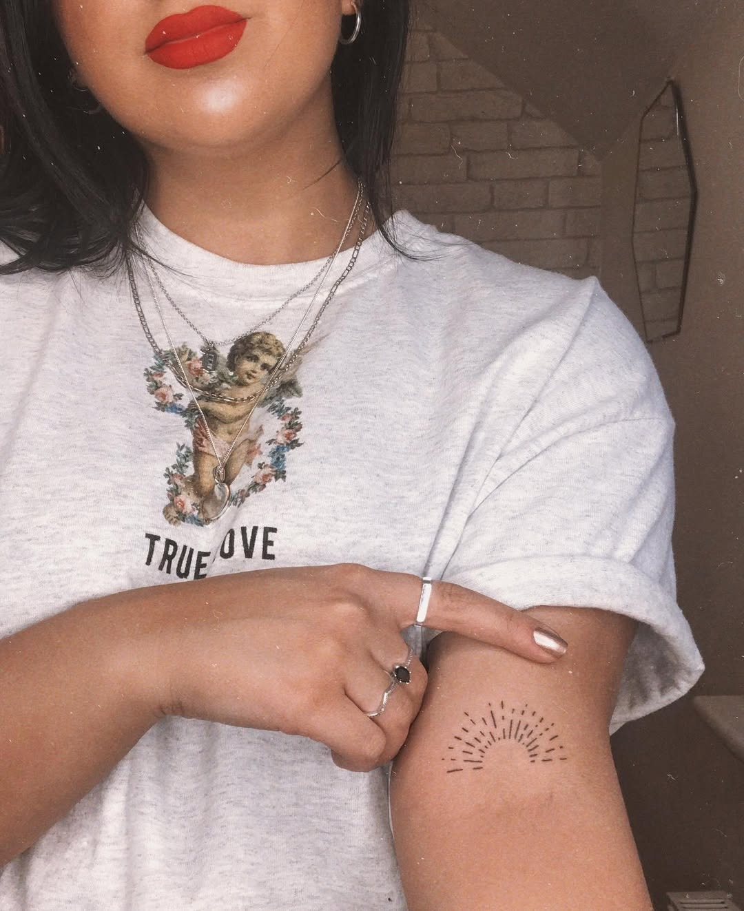 Charming sunrise tattoo on a woman's arm Tattoo Design