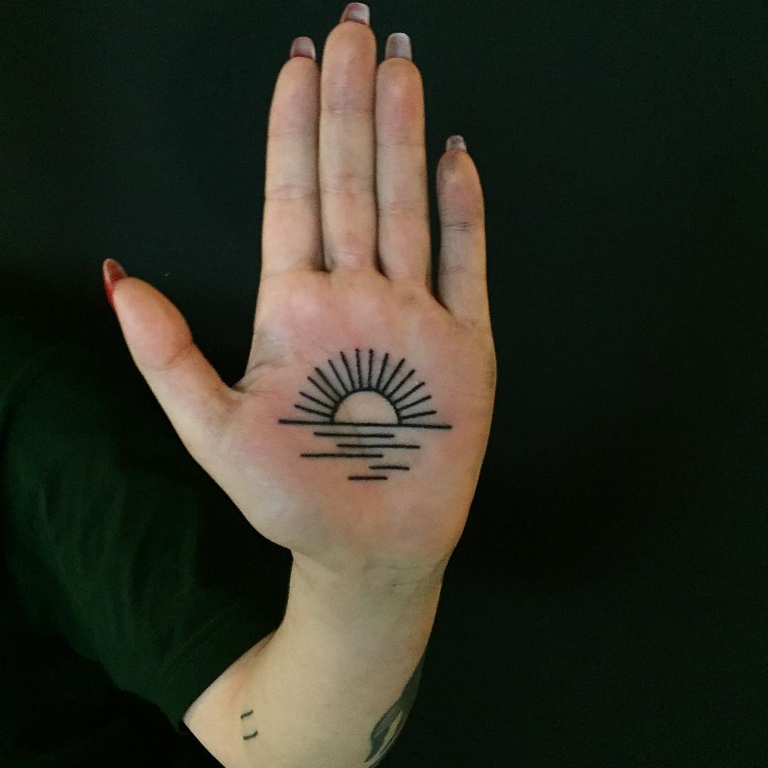 Minimalist sunrise tattoo on hand's palm Tattoo Design