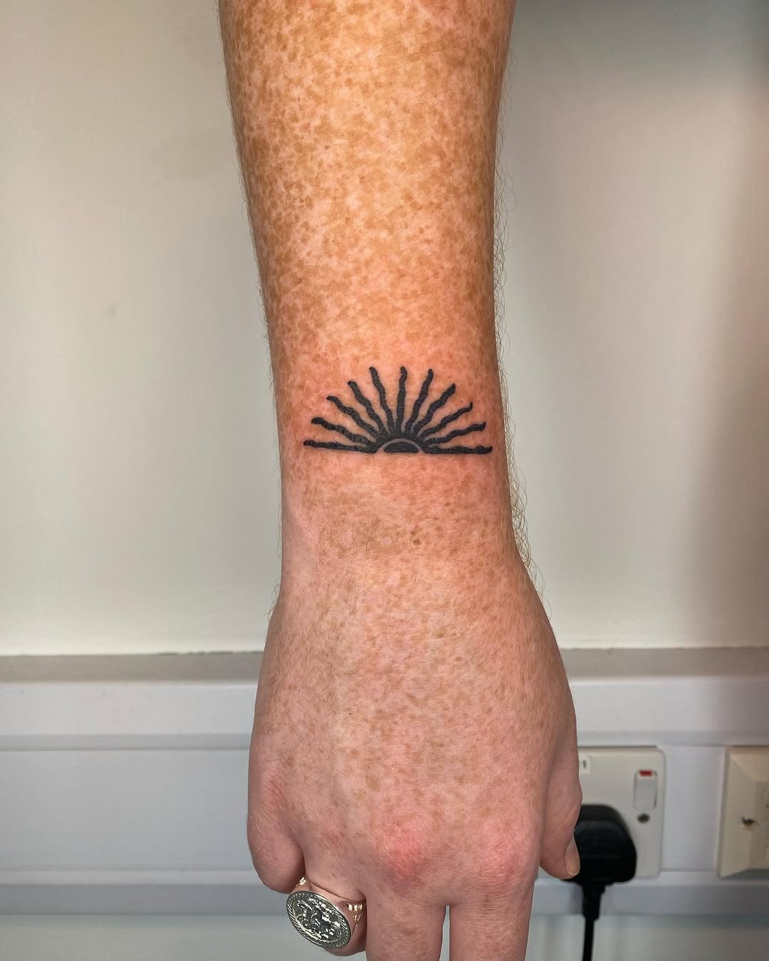 Minimalist sunrise tattoo radiates positive energy Tattoo Design