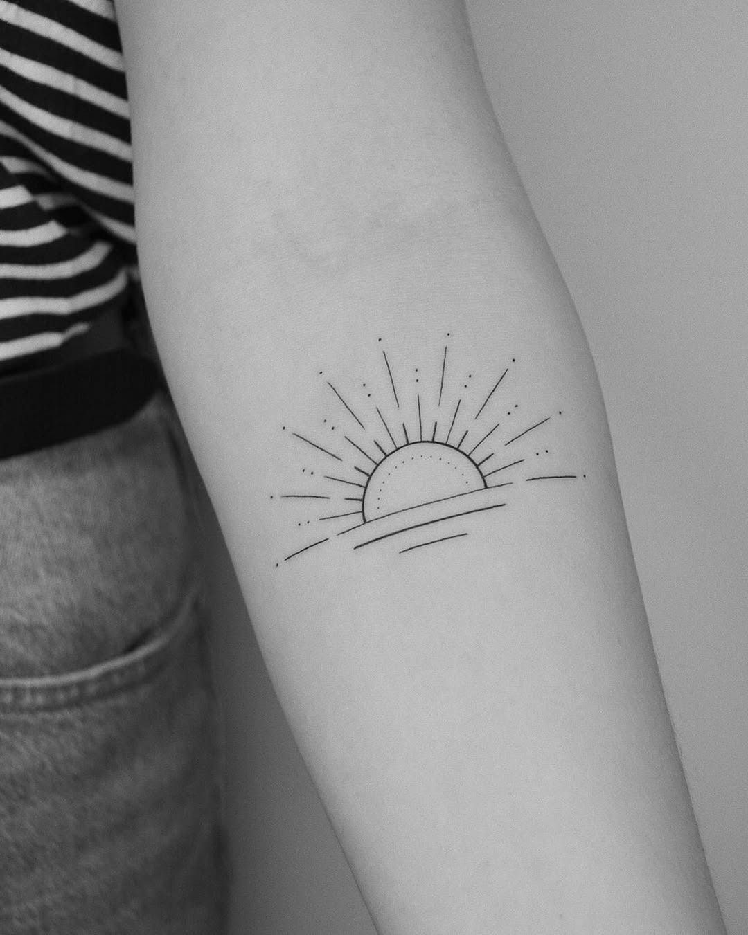 Minimalist sunrise tattoo with delicate lines Tattoo Design