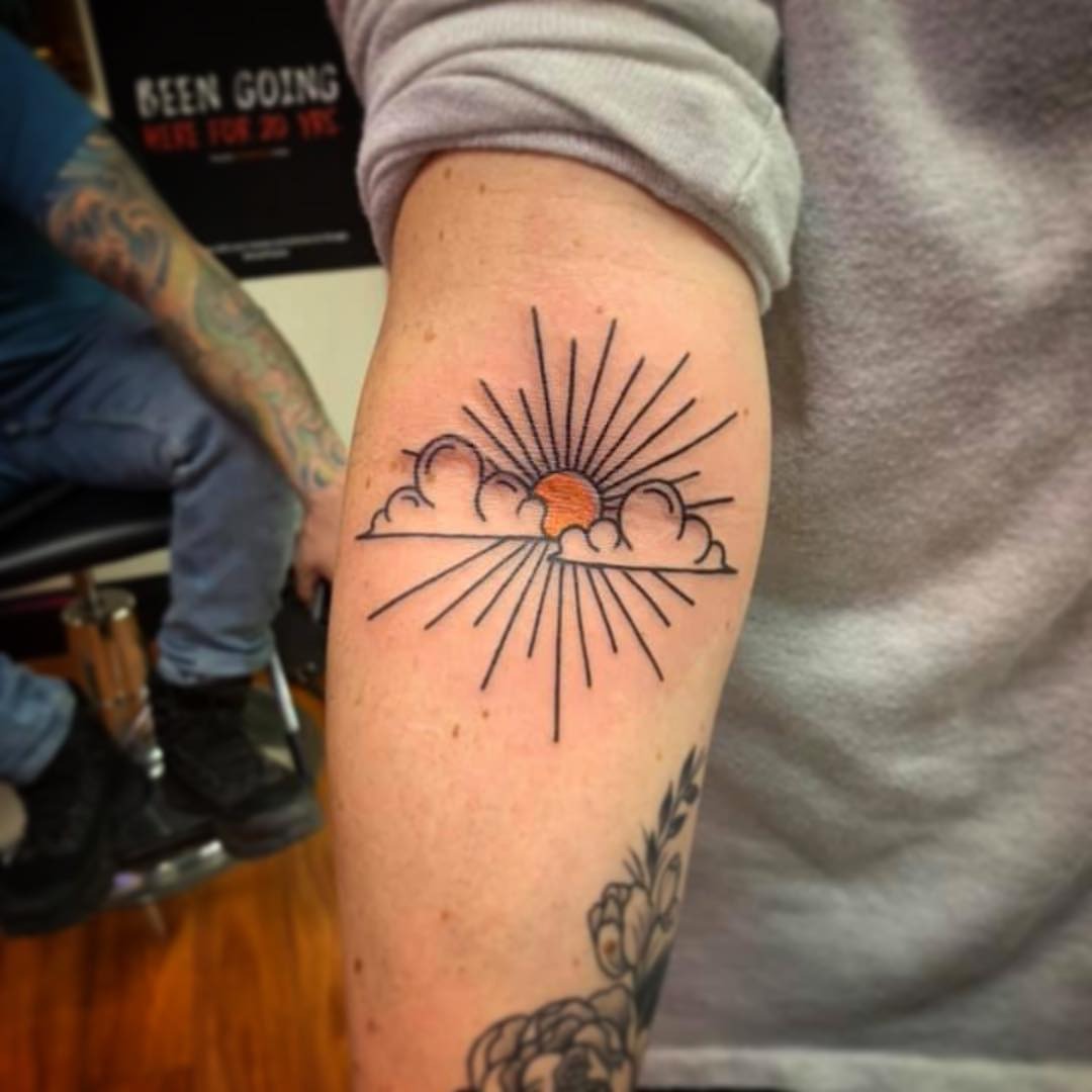 Stunning sunrise tattoo with rays and clouds Tattoo Design