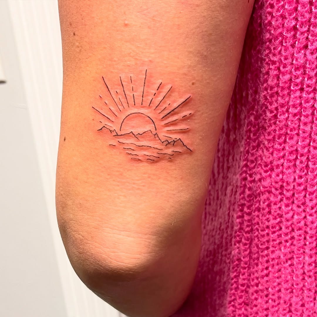 Stunning Sunrise with Mountains and Waves Embrace Tattoo Design