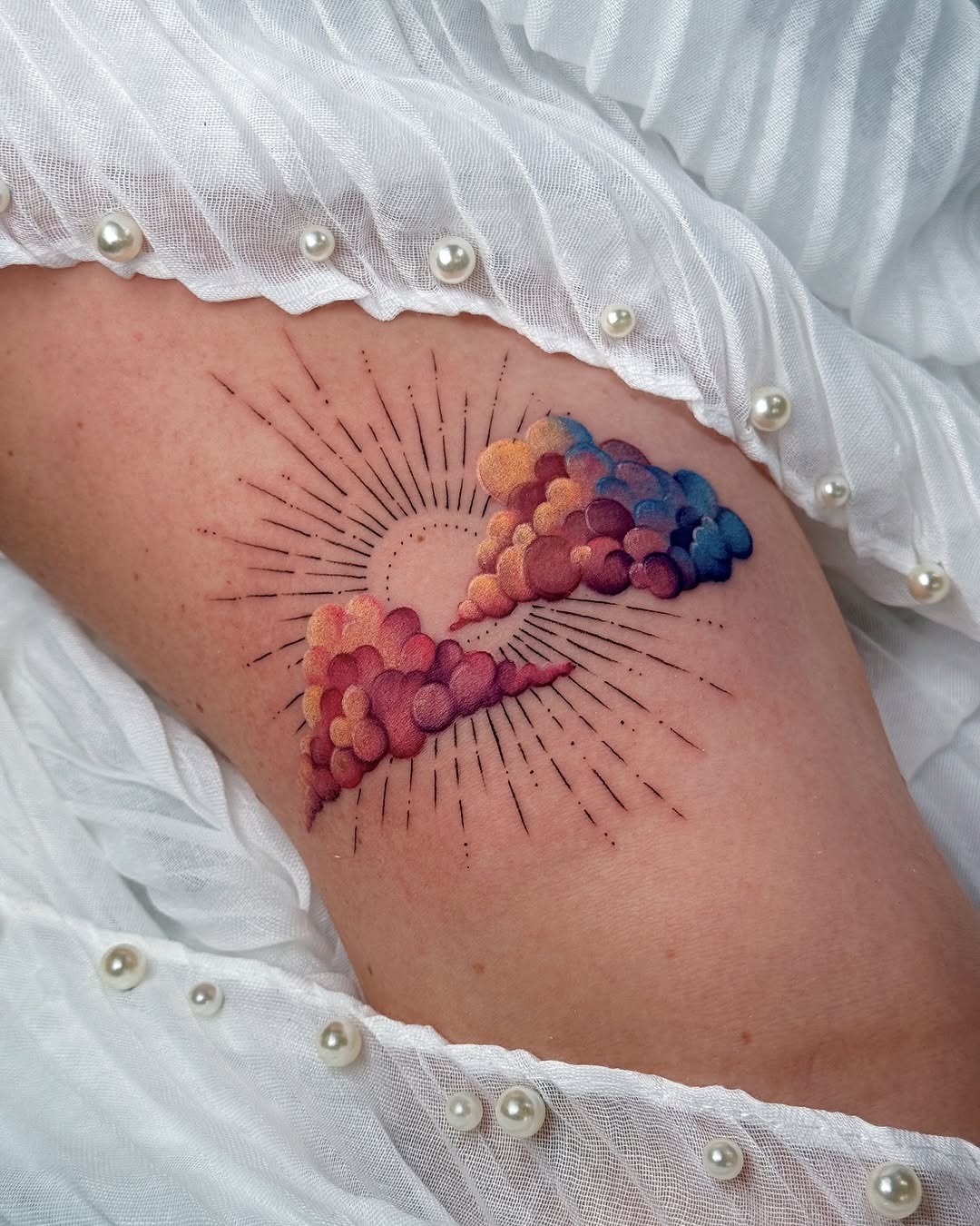 Vibrant sunrise tattoo with colorful cloud details Tattoo Design