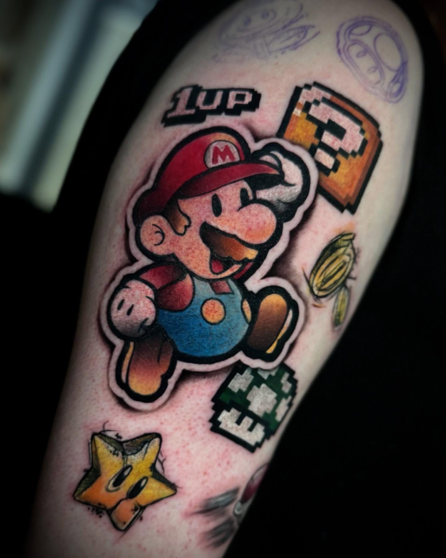 Colorful Pixelated Mario Tattoos Splashing Fun Tattoo Design