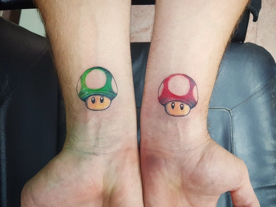 Mario and Yoshi Celebrate an Iconic Moment Tattoo Design