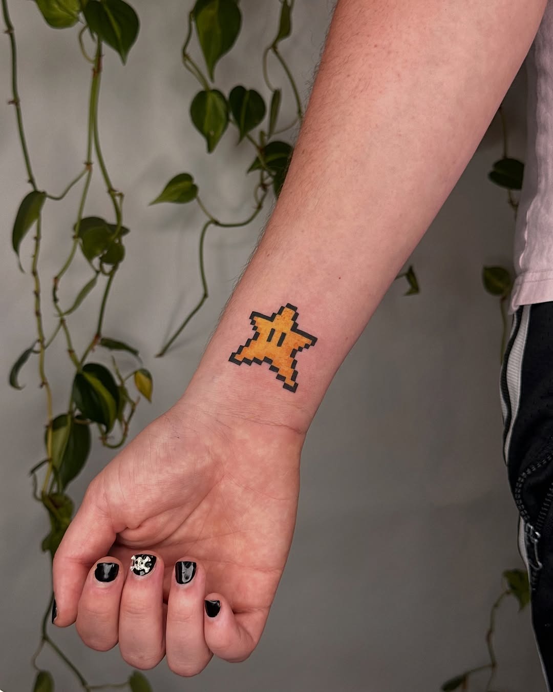 Playful pixel star tattoo capturing retro charm Tattoo Design