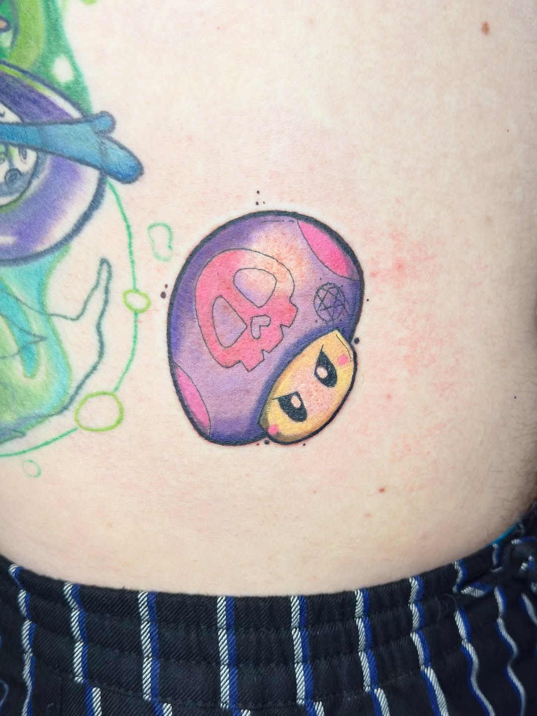 Playful Yoshi tattoo full of vibrant colors Tattoo Design