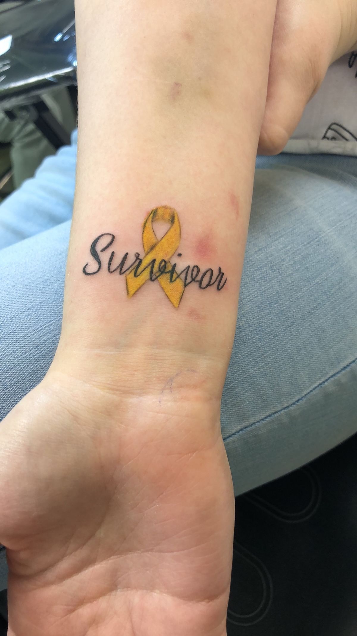 Elegant Script "Survivor" Collarbone Tattoo Tattoo Design